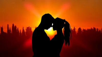 Silhouetted Kiss in an Orange Sunset HD Wallpaper