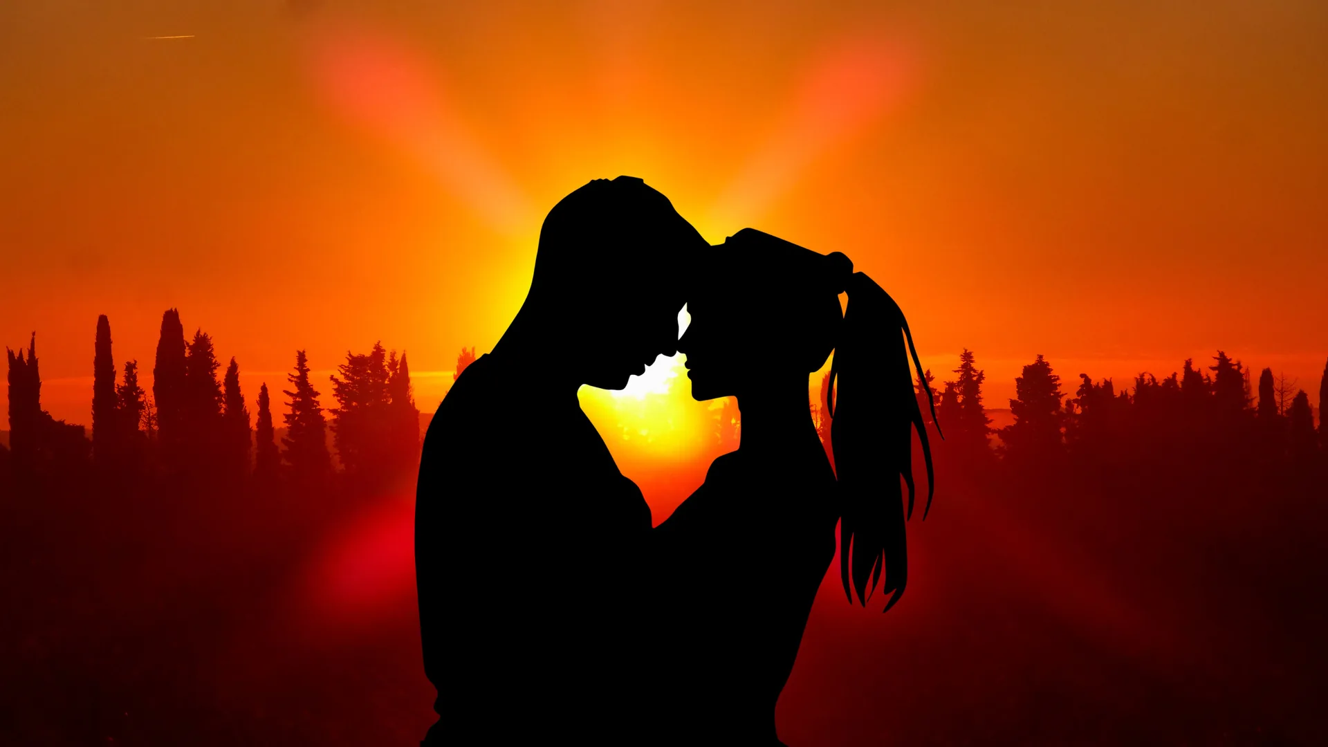Two figures lean in close as the sun flares between their faces, a treeline running along the bottom and the sky burning from gold to deep orange.
