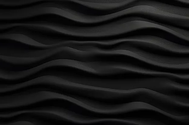 Sculpted wave ridges run across a matte black panel, each crest catching a thin grey highlight while the troughs stay in full shadow.
