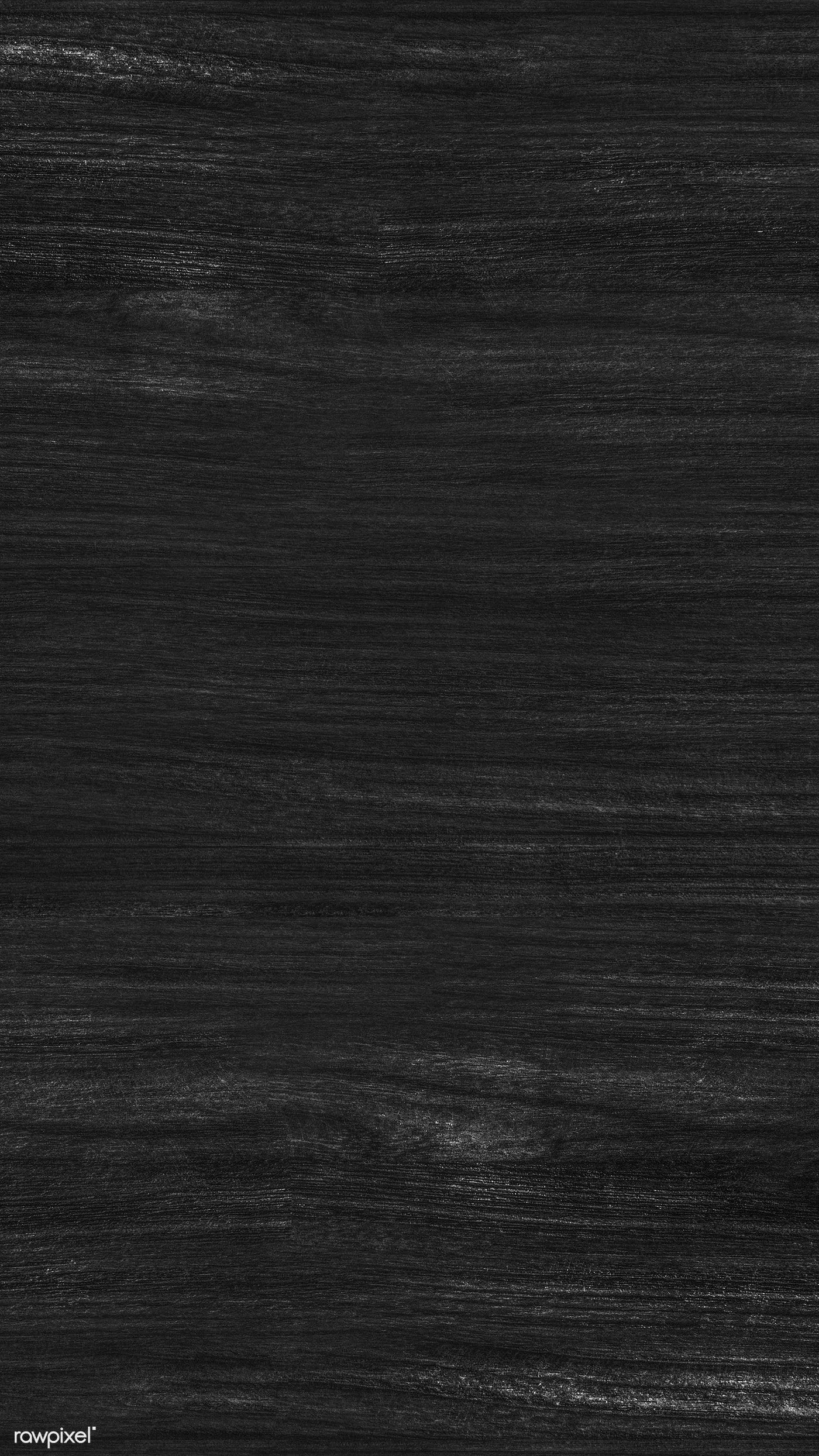 Long vertical grain runs the height of a tall frame in near-black timber, a few pale scratches breaking the surface near the top.