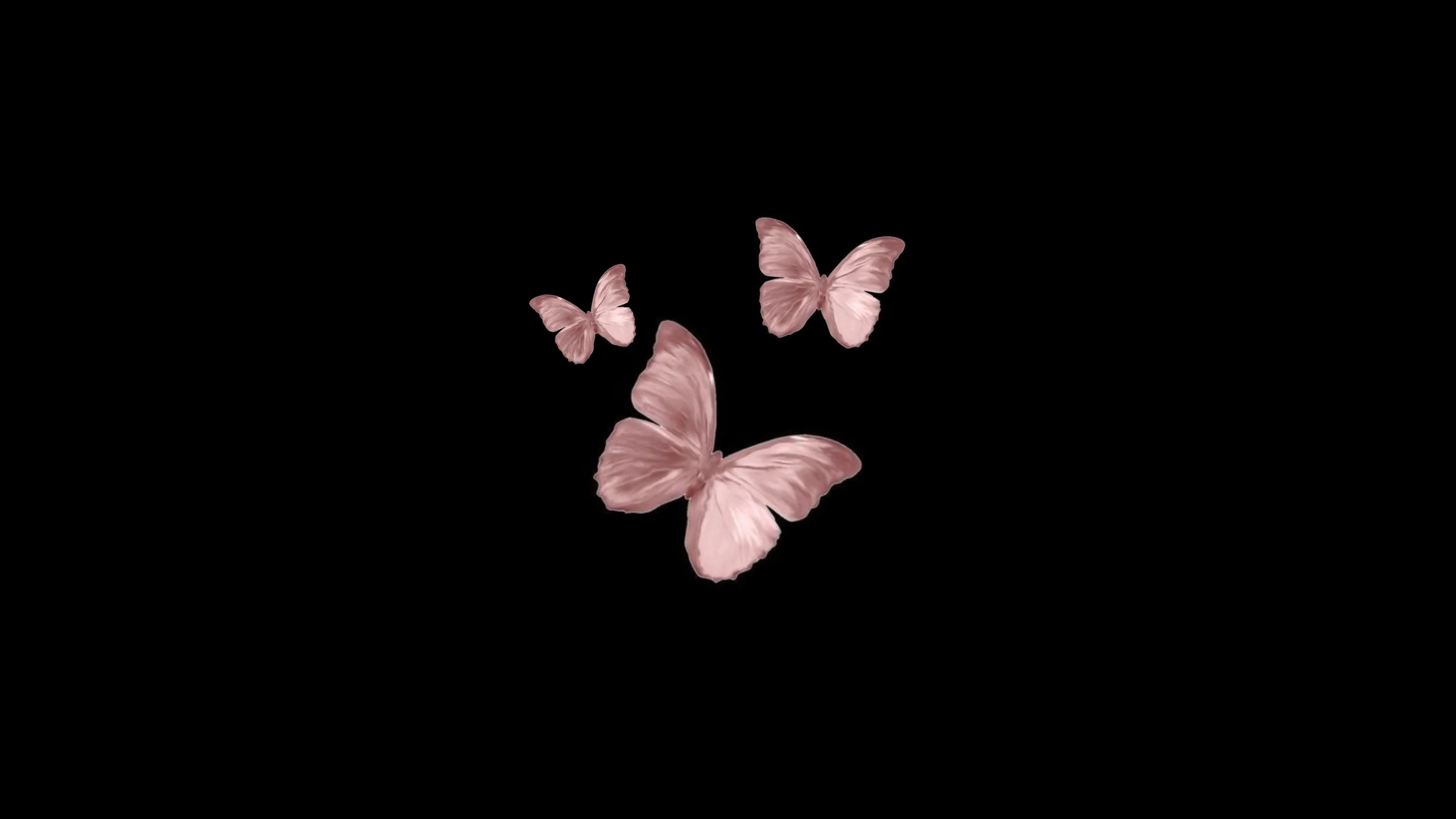 Three rose-gold butterflies cluster right of centre on a pure black field, leaving the whole left half free for a desktop's icons.