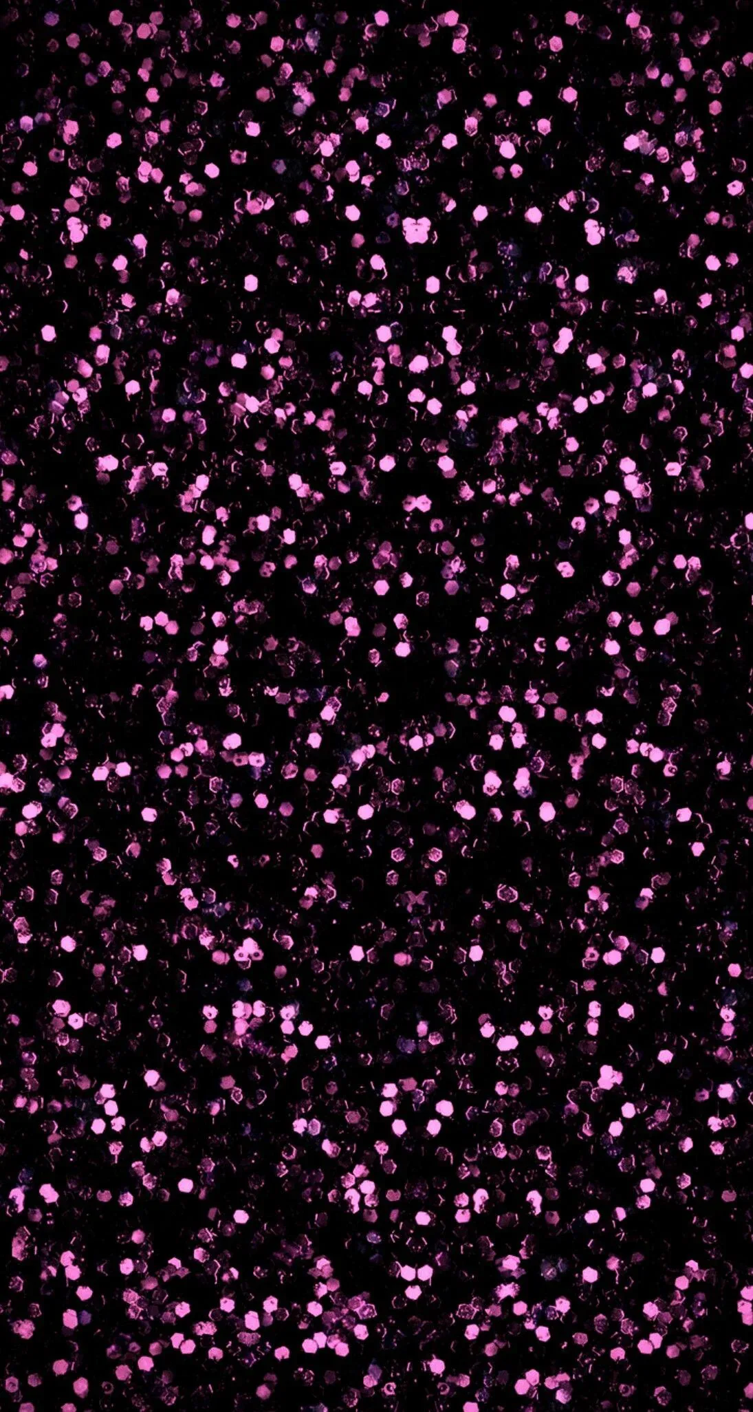 Round magenta sequins pressed into a black ground, packed tighter through the middle band, small black gaps showing between almost every dot.